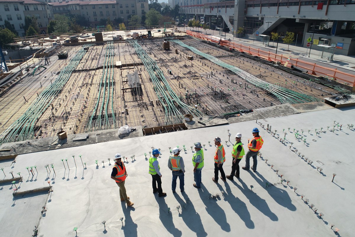 Site engineers inspecting reinforced concrete construction